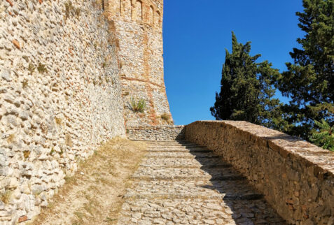 Montebello Castle and legend of Azzurrina - Staircase leading to the castle from which you can see one of the towers - BBOfItaly