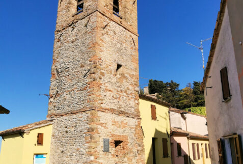 Montebello Castle and legend of Azzurrina - The tower in Montebello village, with the Castle behind - BBOfItaly