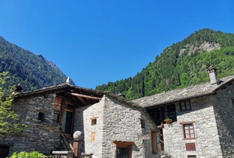 Viewpoint of Otro - The start of the path with behind the houses the mountain where there is Otro hamlet - BBOfItaly