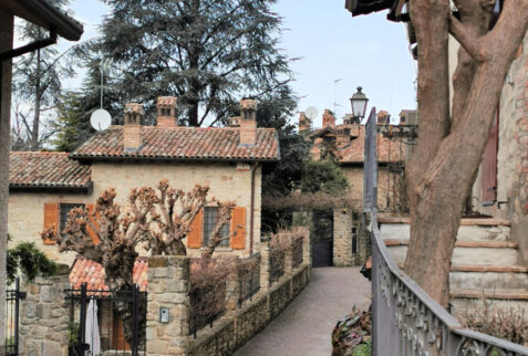 A tiny road inside old part of Fortunago village. On the side of the road are located ancient houses restored keeping the old characteristics