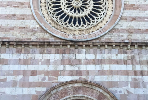 Assisi - glimpse on rose window of Basilica di Santa Chiara