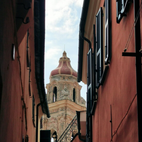 Cervo – the tower bell of the church seen through an alley - BBofItaly